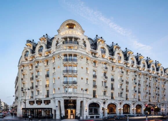 Elegant exterior of the historic Hotel Lutetia in Paris, featuring Art Nouveau architecture and intricate stonework, offering luxurious accommodations with Natlaupa