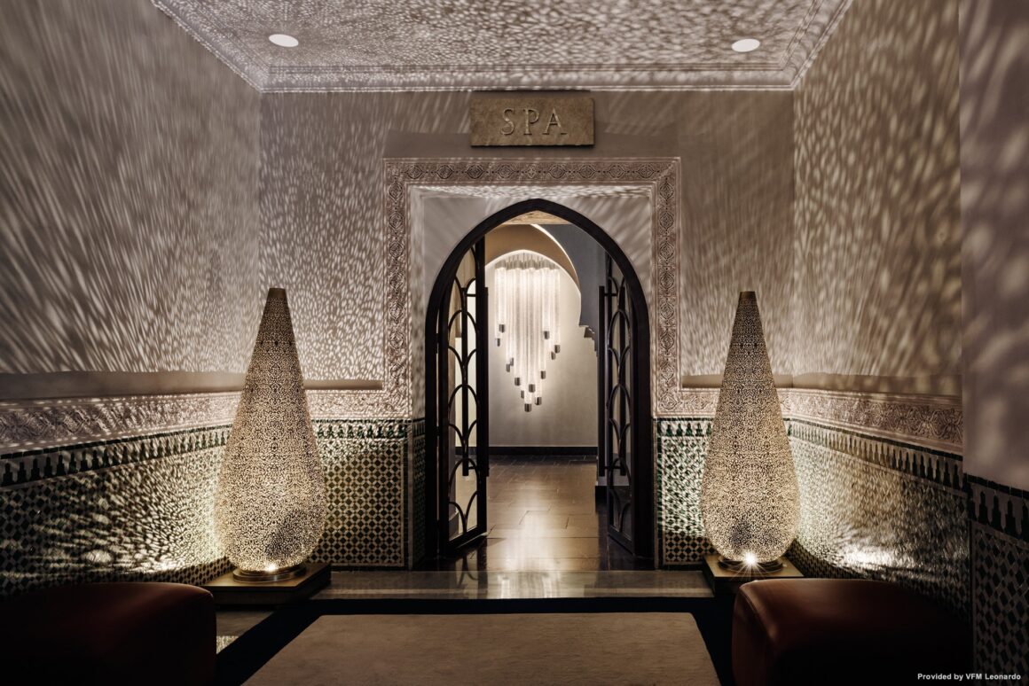 Elegant entrance to the La Mamounia Marrakech wellness area, featuring intricate Moroccan lanterns and tilework with Natlaupa.