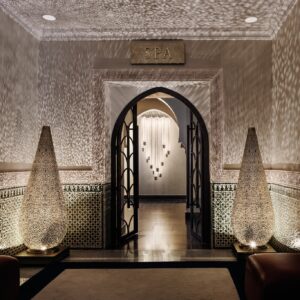 Elegant entrance to the La Mamounia Marrakech wellness area, featuring intricate Moroccan lanterns and tilework with Natlaupa.