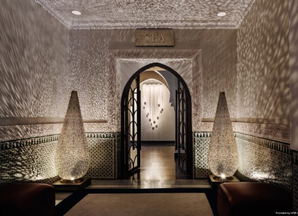 Elegant entrance to the La Mamounia Marrakech wellness area, featuring intricate Moroccan lanterns and tilework with Natlaupa.