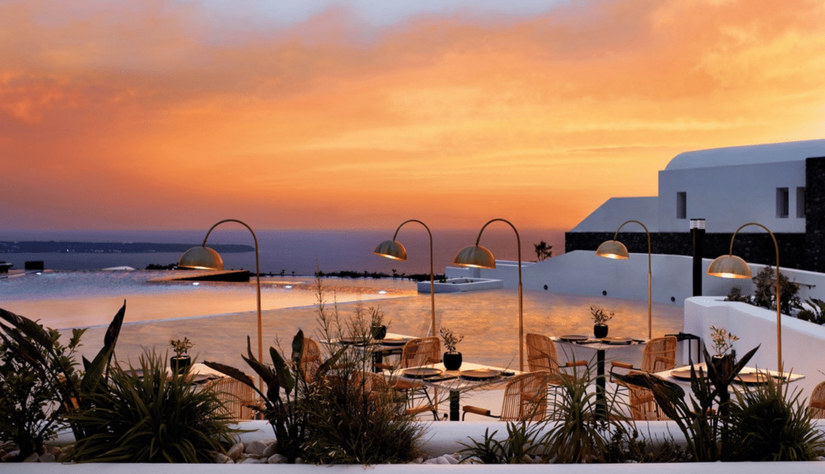 Savor breathtaking sunset dining at Santo Maris Oia with Natlaupa, where luxury meets the Aegean Sea.