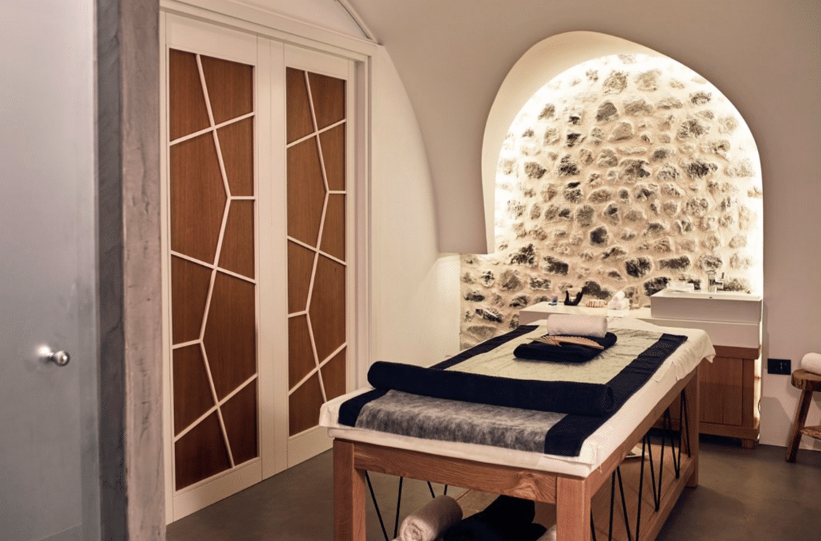 Experience ultimate relaxation in a luxurious massage room at Santo Maris Oia with Natlaupa.