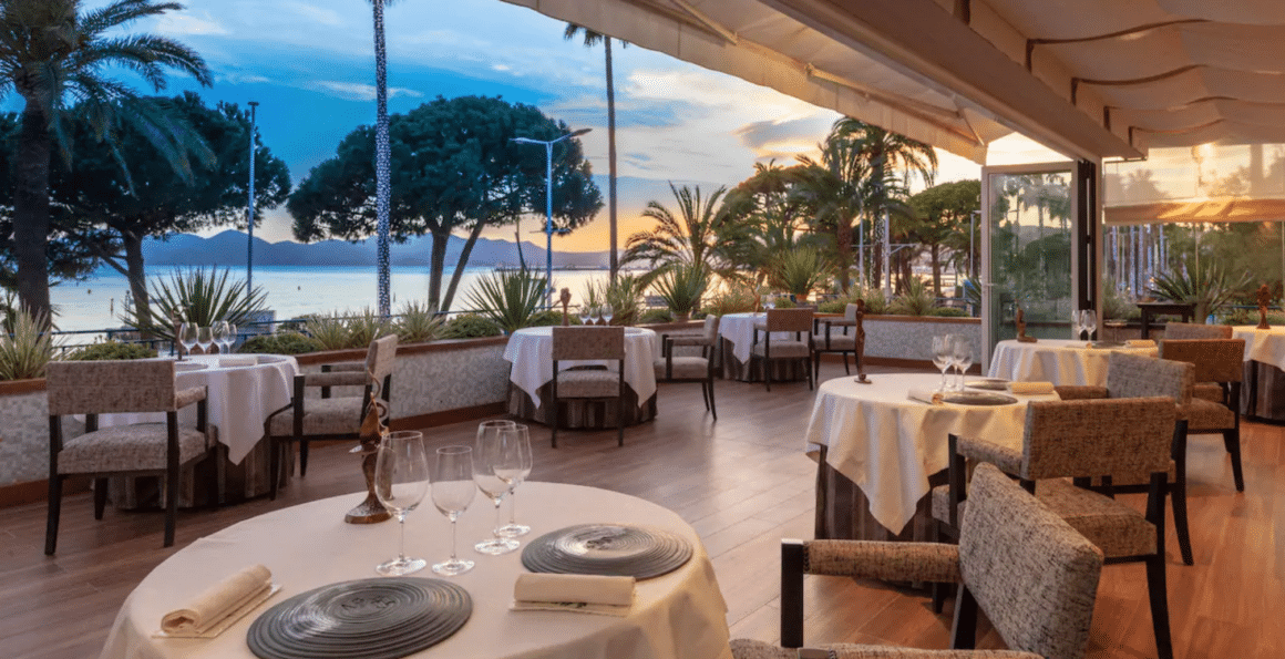 Enjoy a luxurious seaside dining experience at Hotel Martinez with Natlaupa, where breathtaking views meet refined elegance.